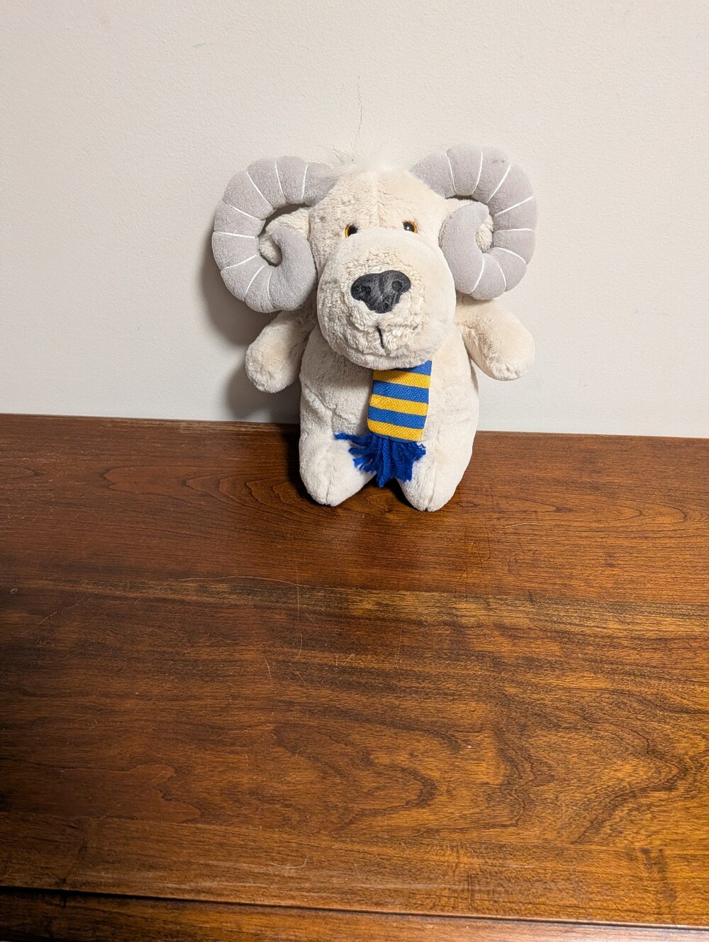 Steven Smith. Plush Ram  in Cream with Blue & Yellow Scarf And Gray Hornsn